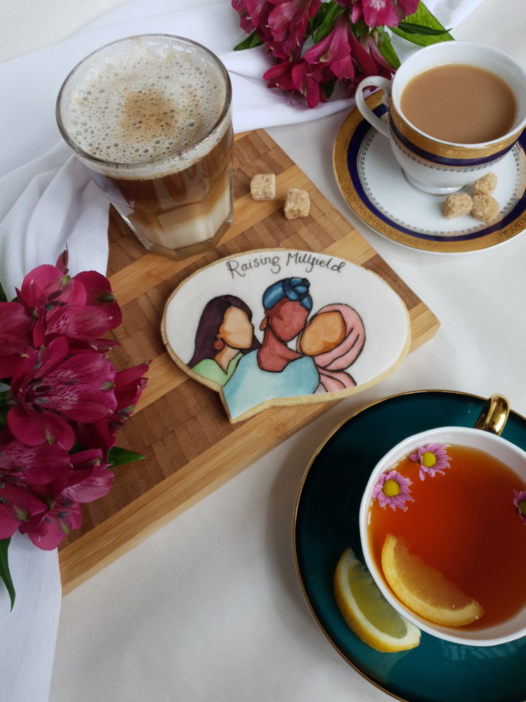 Raising Millfield promotional image. A picture of a painted biscuit.